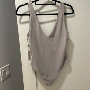 V neck thong body suit by babaton size l buy will fit m nwt retails 48 greyish